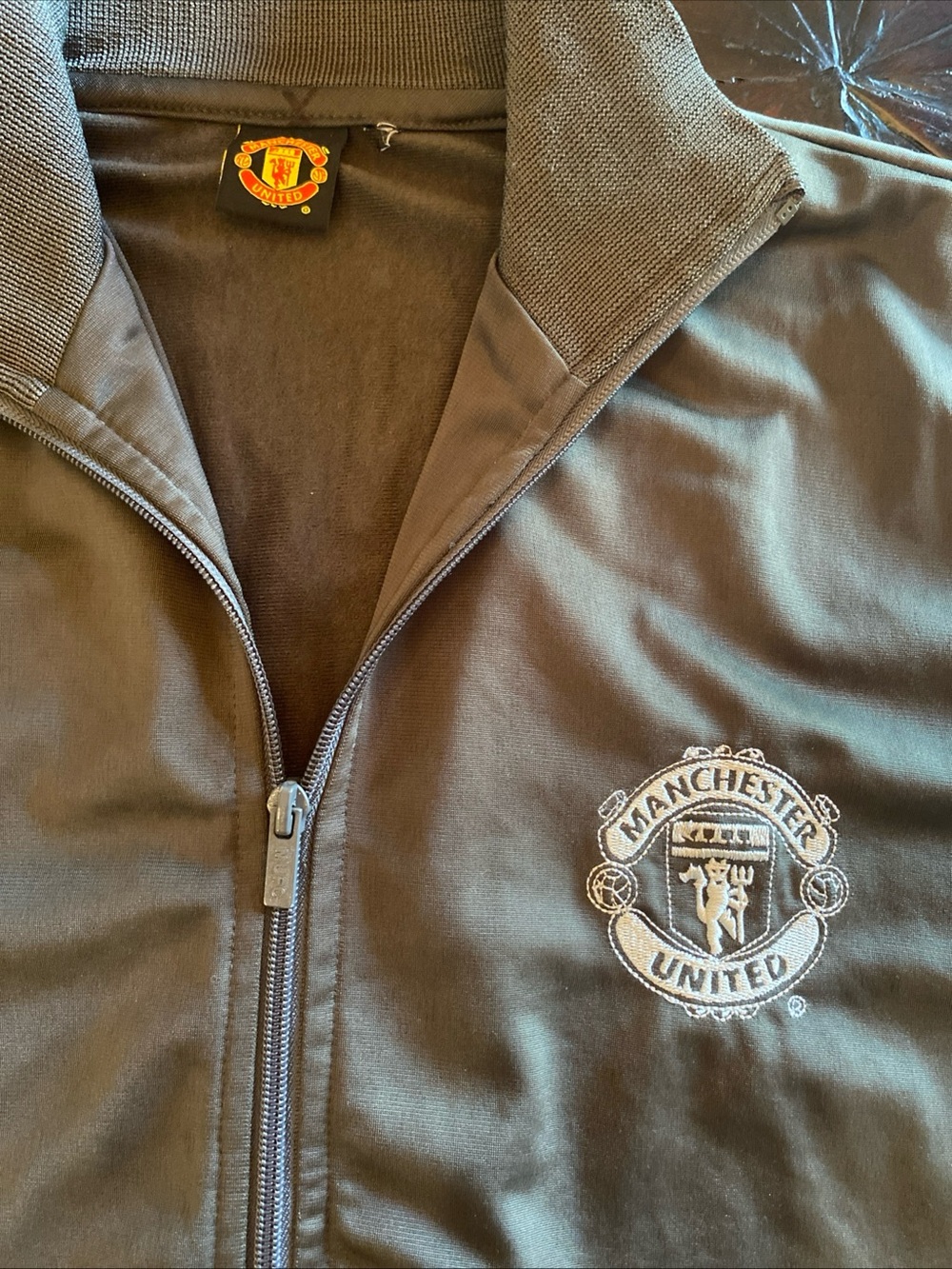 Vintage Official Manchester United Men's Black Zip-Front Jacket. Hard to find.
